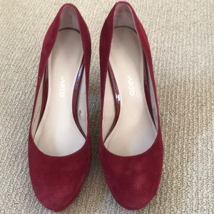 Red suede platform pumps